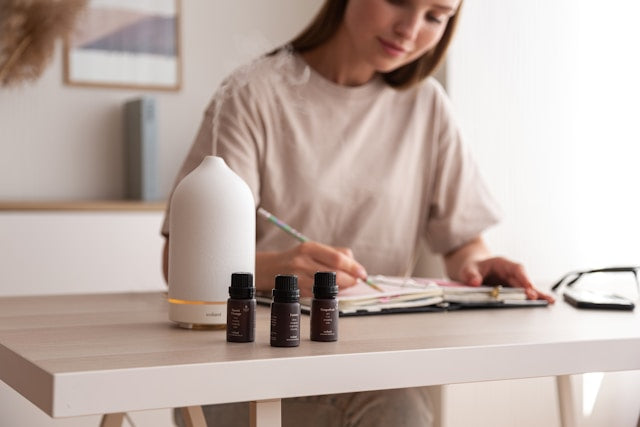 Create an image of a diverse set of room diffusers lined up on a shelf, each labeled with different scents and features, with a beginner standing in front, studying them thoughtfully. The diffusers sh